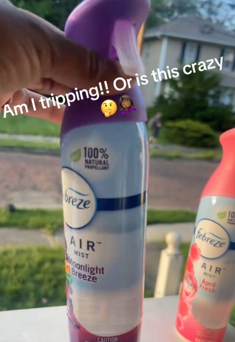 Woman's hand on Febreeze container